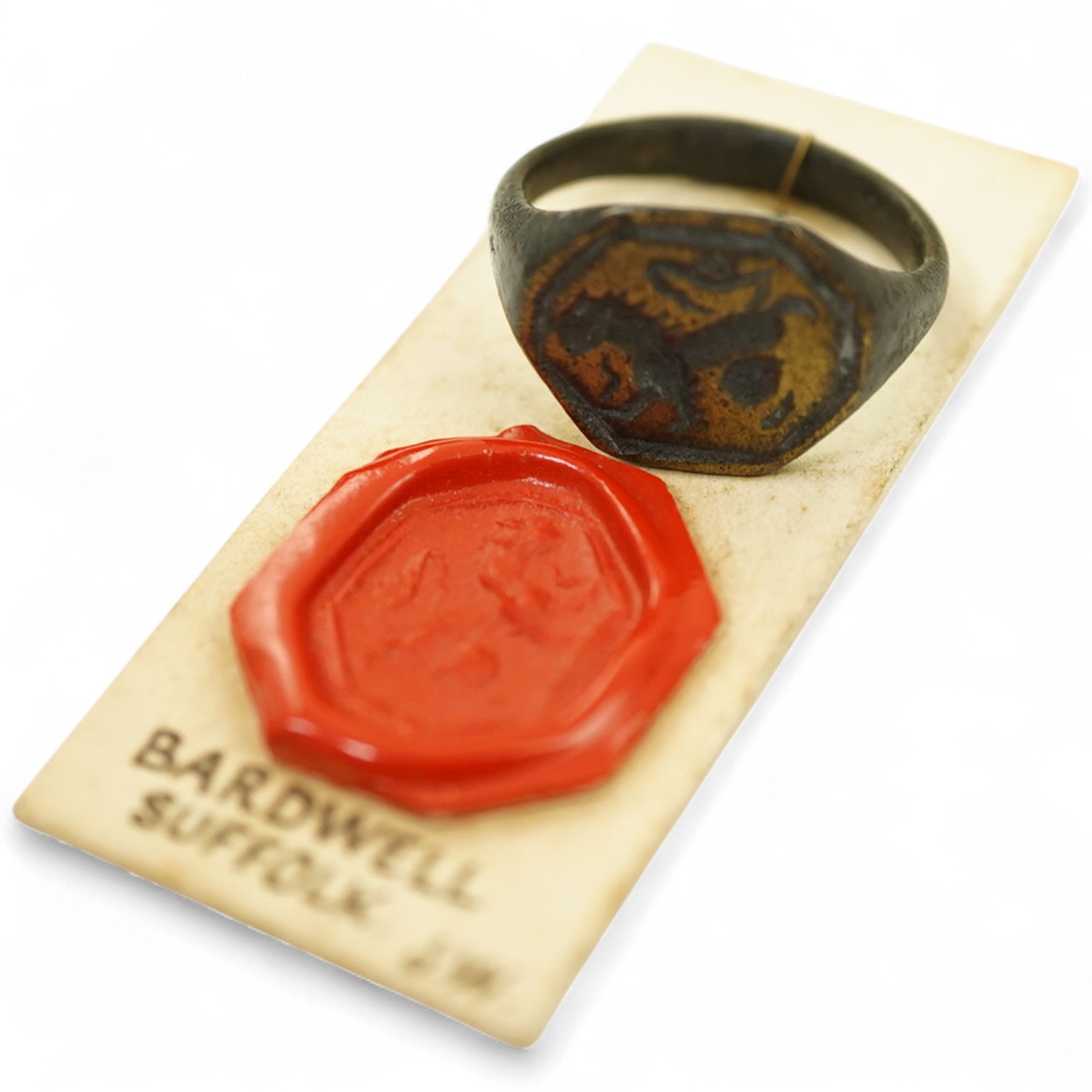 A Tudor bronze heraldic signet ring, England, circa 1500, the octagonal panel carved with a lion rampant, to a plain band, size M, Provenance: formerly in the collection of Dame Joan Evans (1893-1977), By repute, discove
